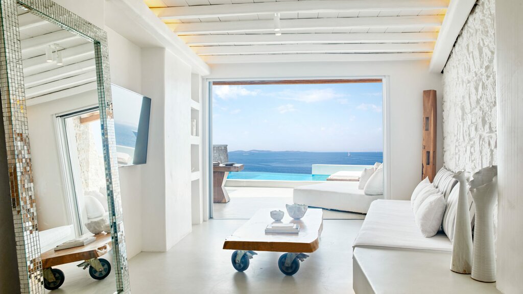 On Mykonos, your base is a luxe retreat carved into the island's cliffs (photo courtesy of Cavo Tagoo Mykonos)