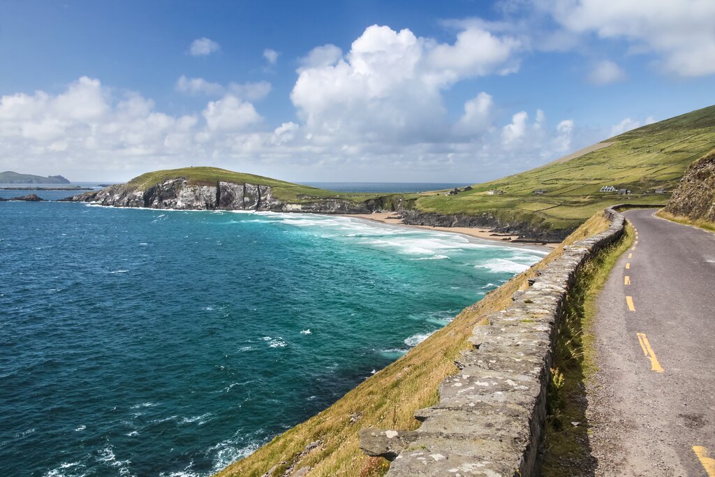 A coastal road by crashing waves