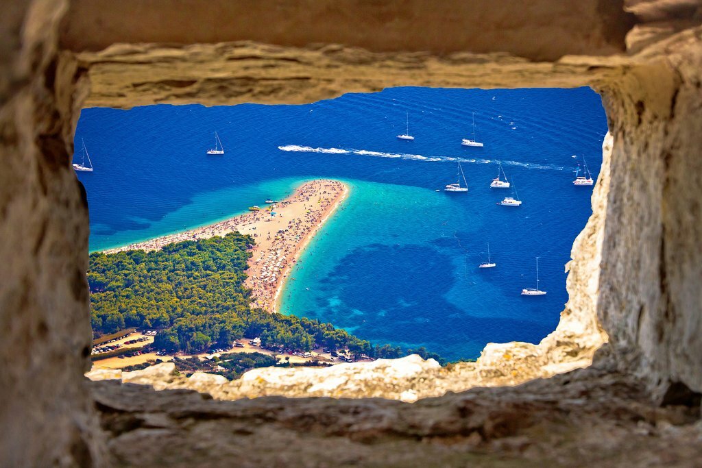 See the famous horn-shaped Zlatni Rat Beach on the island of Brač