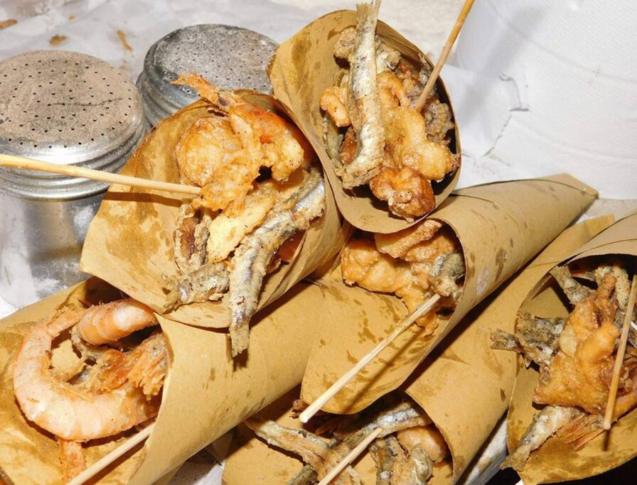 Enjoy cones of fried fish on today's street food tour