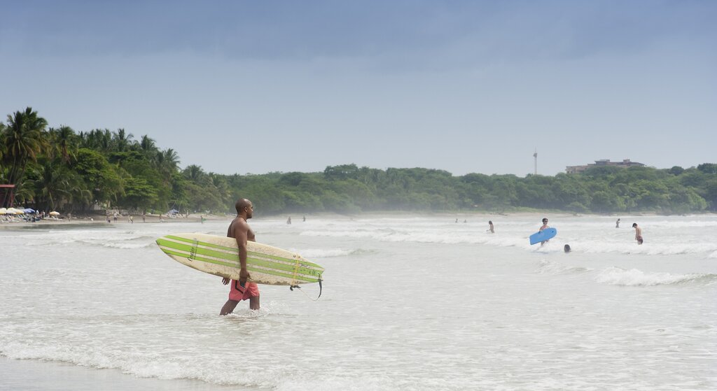 A surfer on Playa Tamarindo