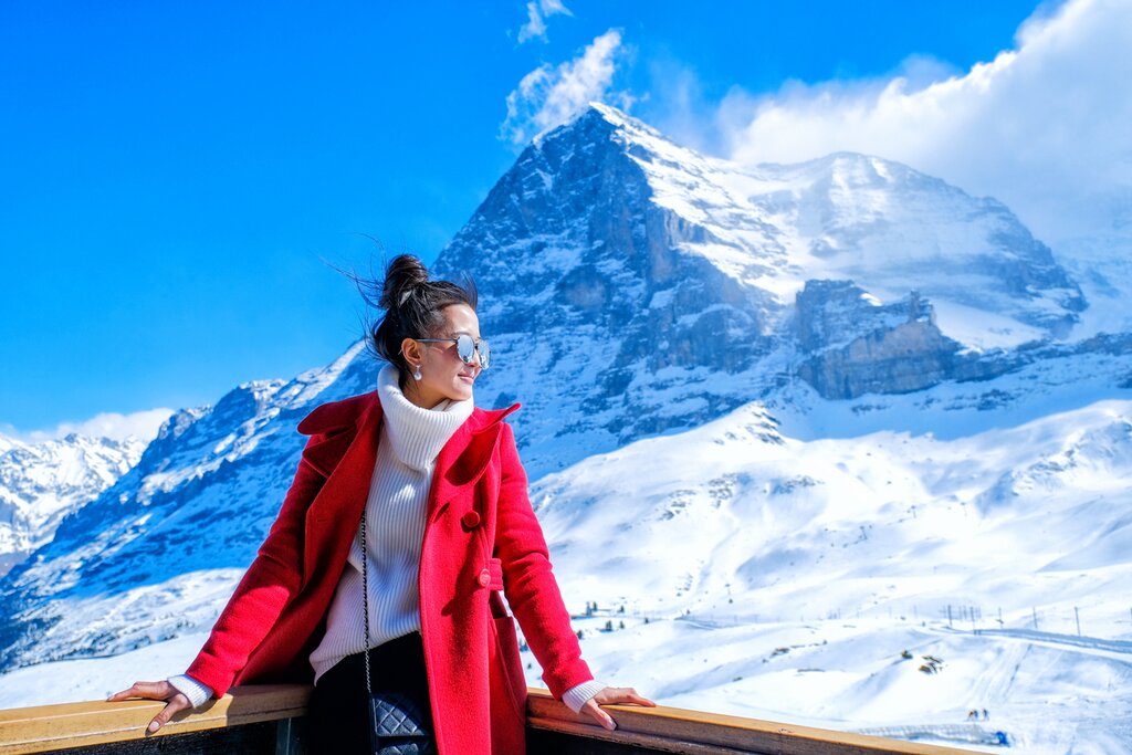 A woman soaks up the views on the Jungfrau railway route