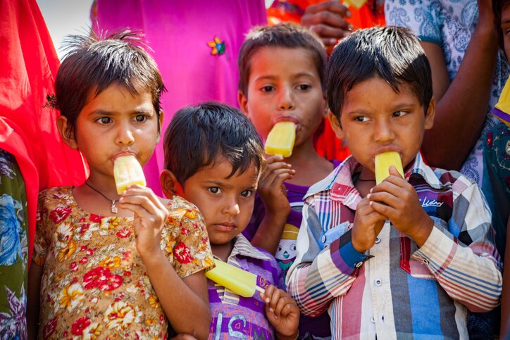 Kids enjoying sweet treats near Jaipur