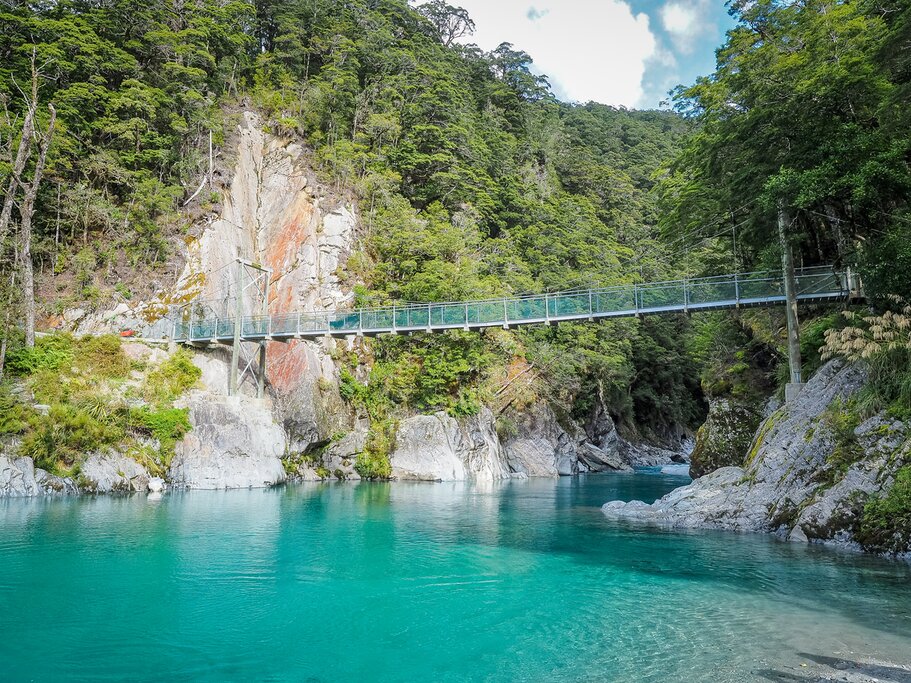 A view of the swing bridge hanging over the Blue Pools