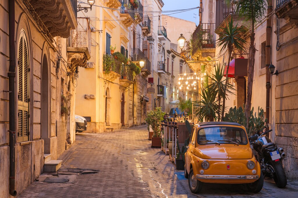 Stroll through the romantic cobbled streets of Syracuse at twilight