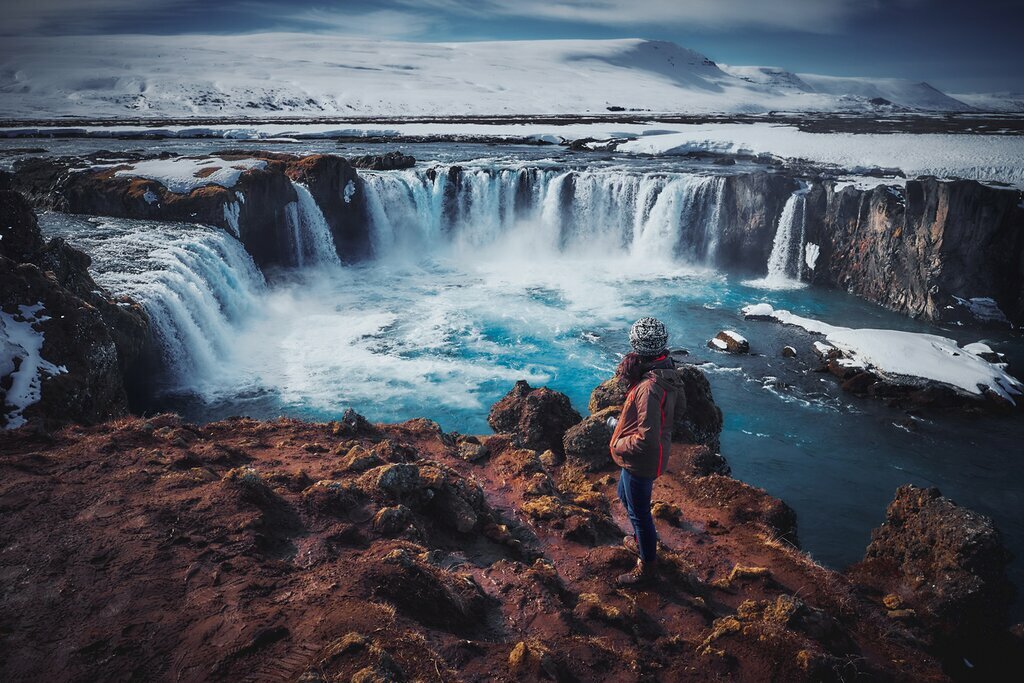 Pondering a frosty waterfall in Iceland