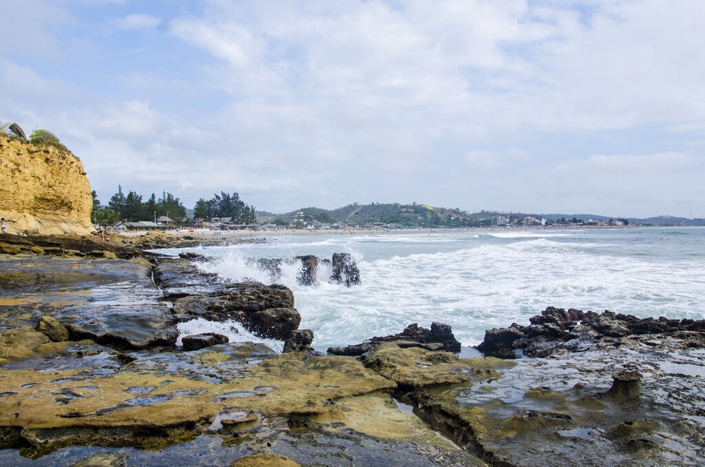 The rocky shore of Moñatita Beach, daytime