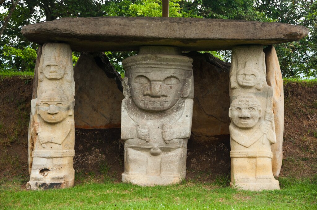 Three ancient pre-columbian statues in San Agustin