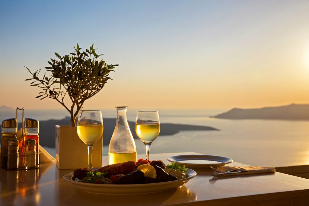 Return to Santorini in time for sunset wine tasting experience