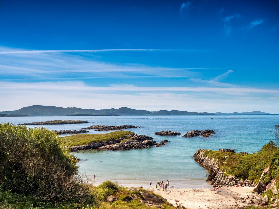 Group of people faraway on a wild beach