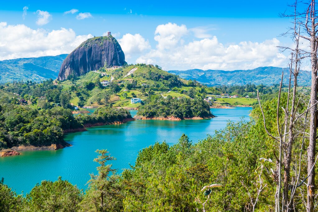 A huge boulder towering above a lake