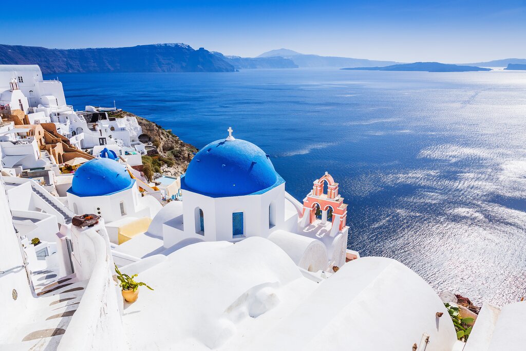 Savor Santorini's sunset with a cruise around the caldera