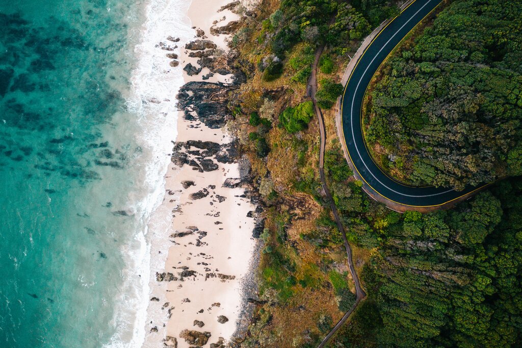 Take a scenic road trip from Brisbane to Sydney, stopping at surf towns like Byron Bay along the way
