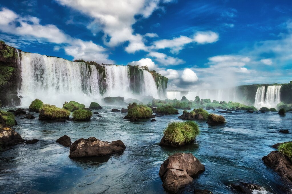 Stand at the edge of Iguaçu Falls, then take a boat trip to its base