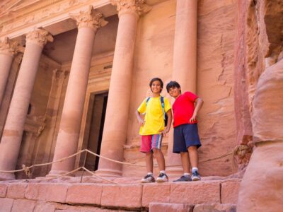 Travellers visiting Petra in Jordan during summer trip