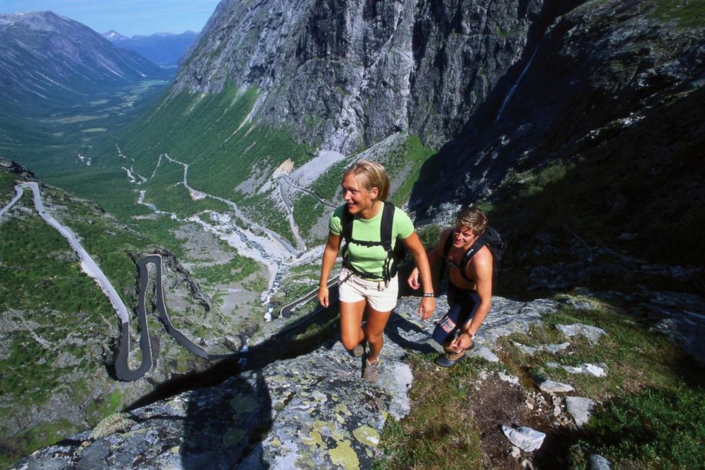 Hiking above the winding Trollstigen mountain road