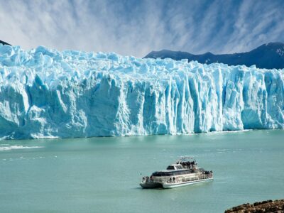 Boat Sailing Near Perito Moreno Glacier, In Patagonia.