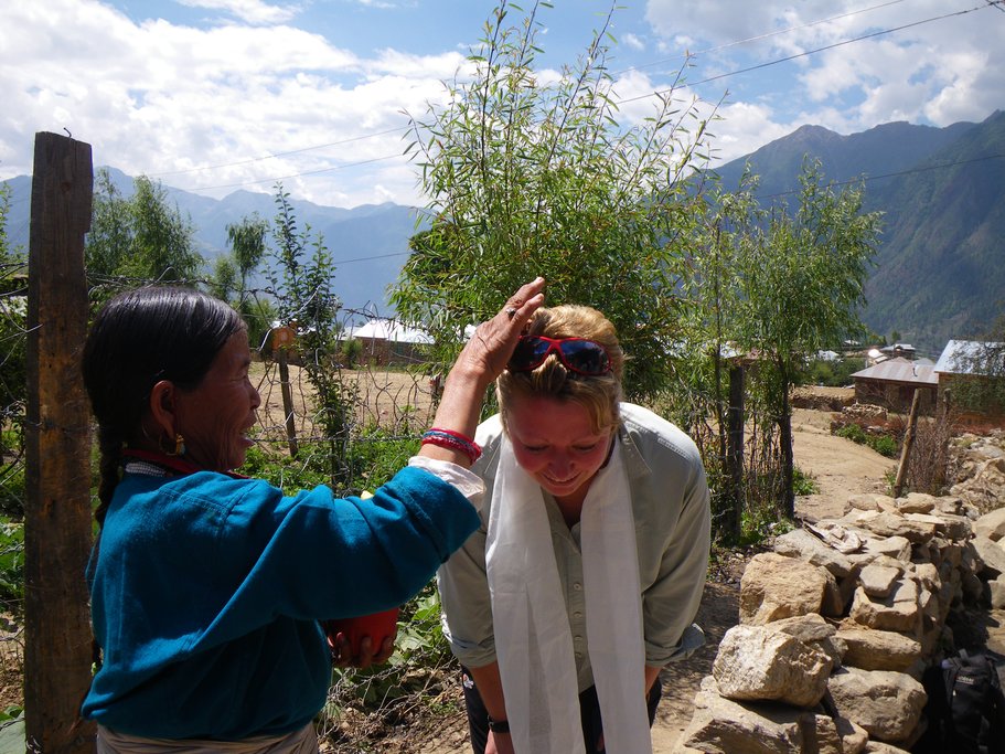 Locals welcome travelers with a white silk scarf and with three blobs of butter, which is highly symbolic in Tibetan rituals 