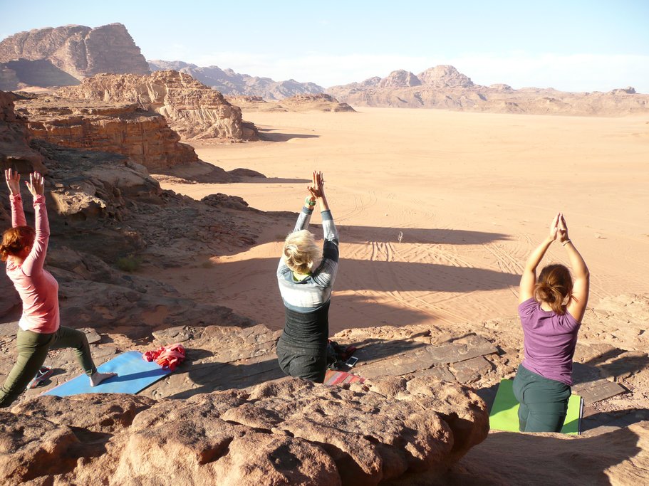 Yoga on rocks in Wadi Rum