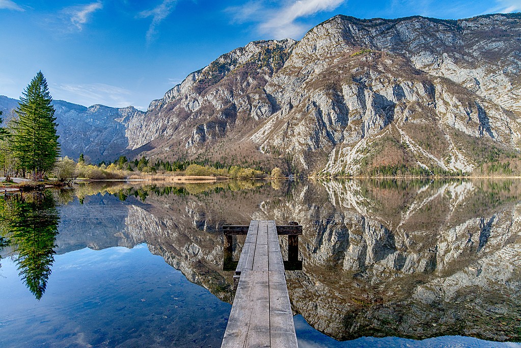 Jump off a dock in Lake Bohinj