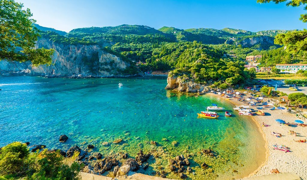 Beautiful beach and boat in Paleokastritsa Corfu island Greece