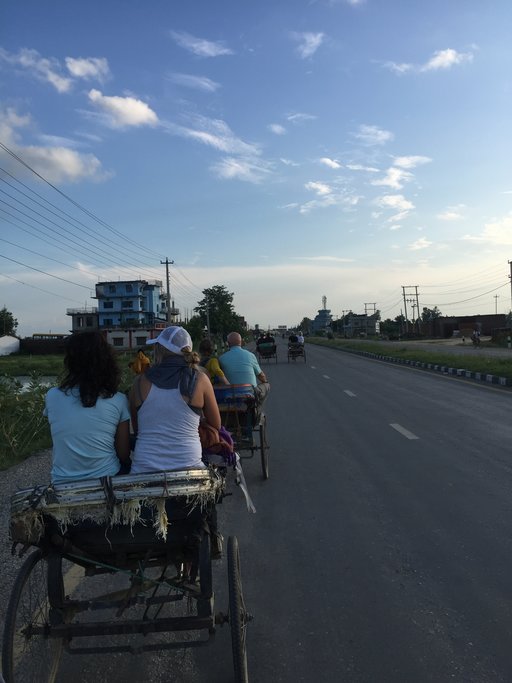 As the sun sets, take an electric rickshaw for a ride through the old village 