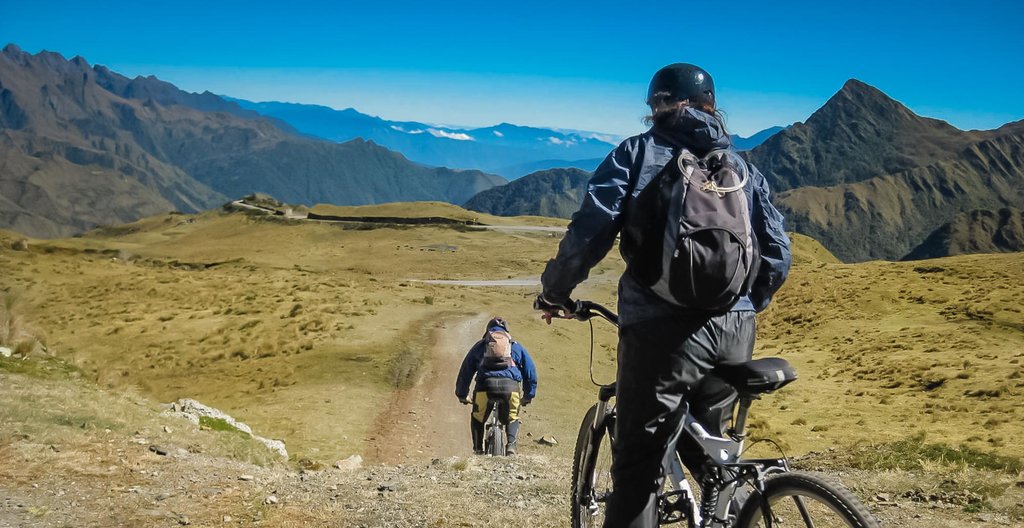 Mountain bikers descend part of the 44-mile road into the Amazon basin.