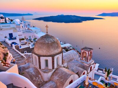 Evening view of Thira town and Aegean sea at sundown, Santorini