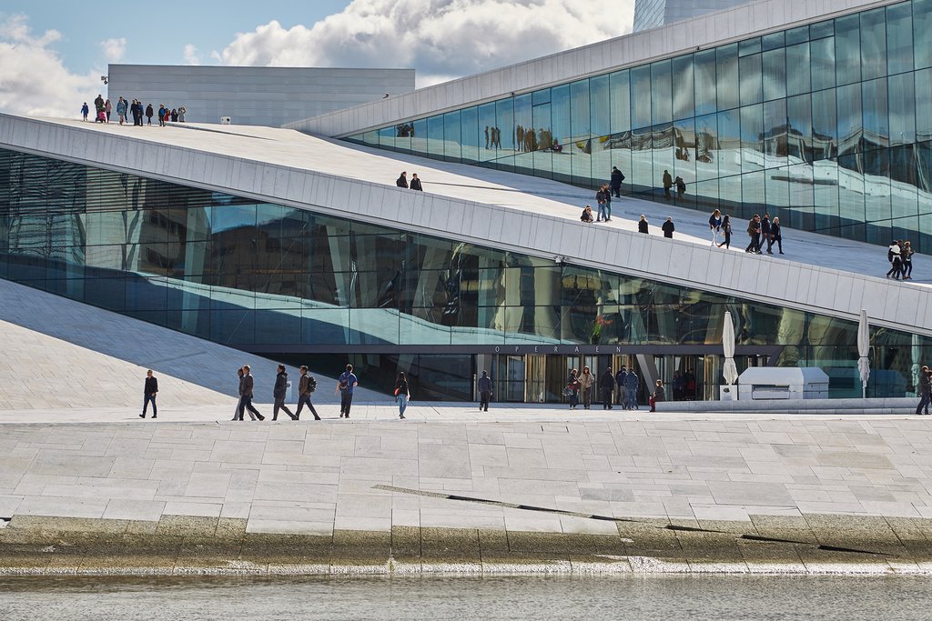 View of Oslo Opera House with people walking in front