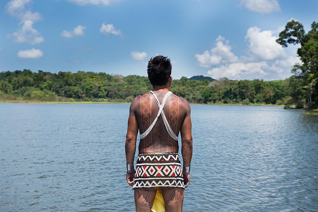 Embera in canoe