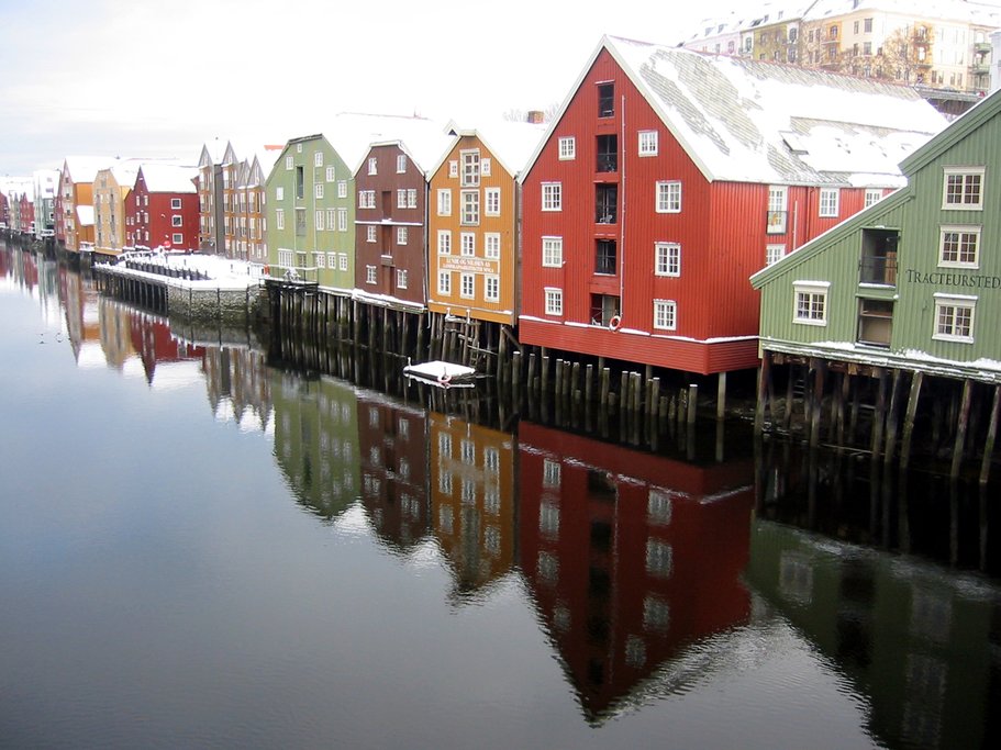 Check out the colorful wooden houses on the river.