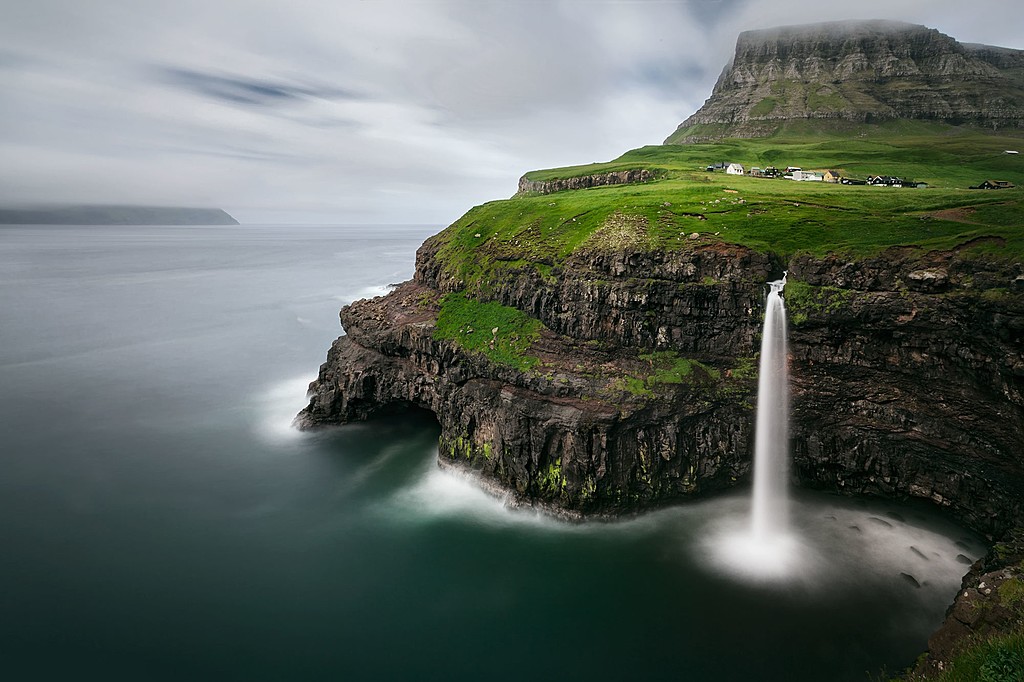The Mulafossur waterfalls cascading into the North Atlantic