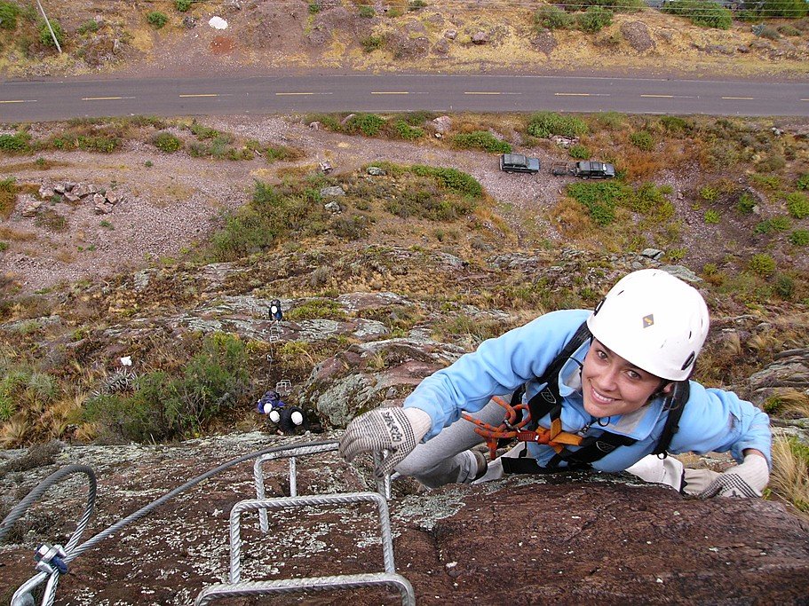 Traveler climbing the Via Ferrata
