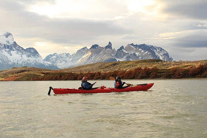 Kayaking against magnificent mountain scenery.