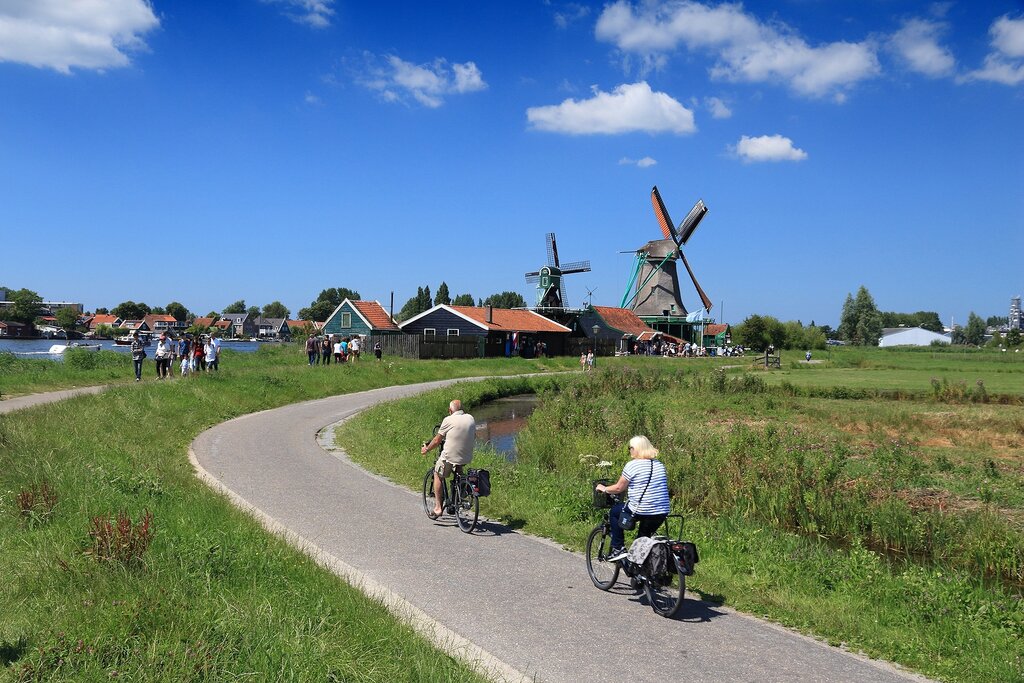 Cyclists visit windmills of Zaanse Schans