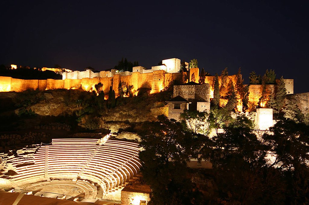 Night falls over Málaga's Alcazaba.