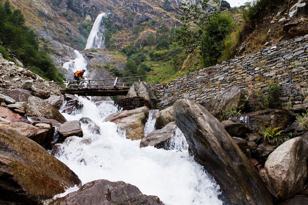 Mountain Biker crossing a bridge in Lower Mustang
