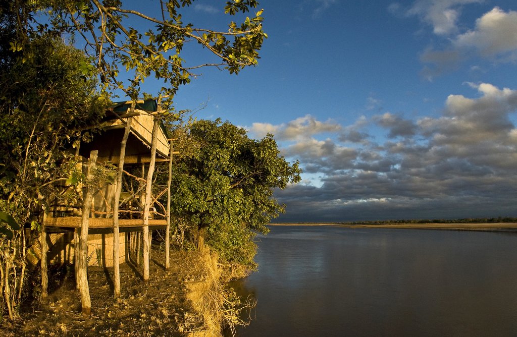 View of Island Bush Camp with an open room facing the river