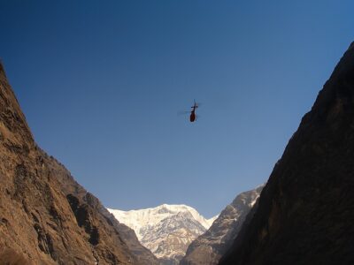 Rescue helicopter in high Himalayan mountains. Annapurna Range in Nepal.
