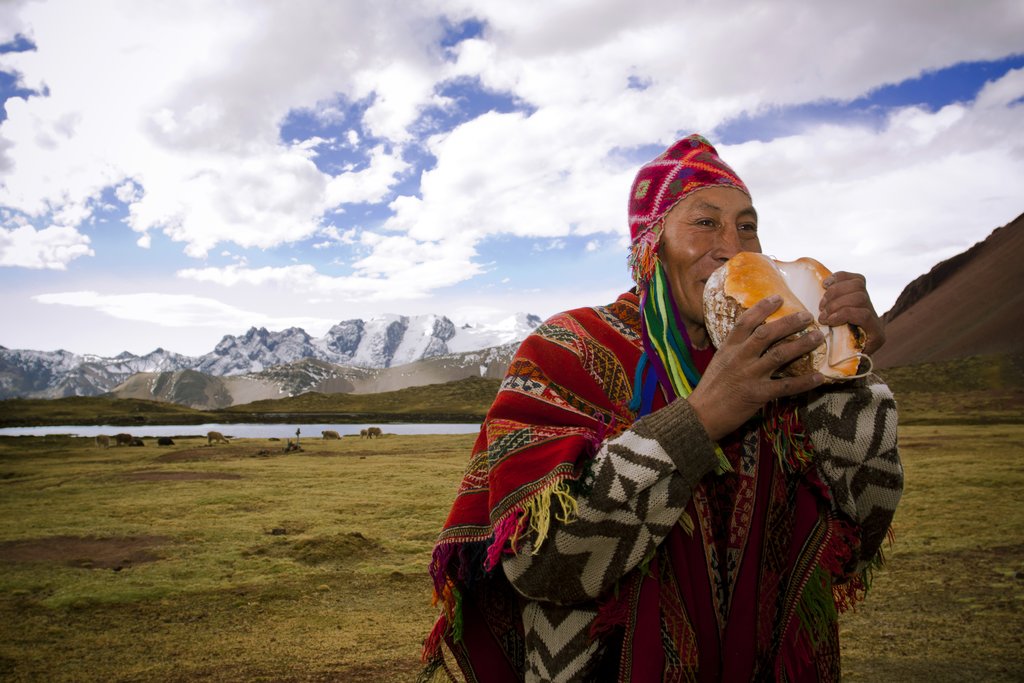 A local man plays the conch shell
