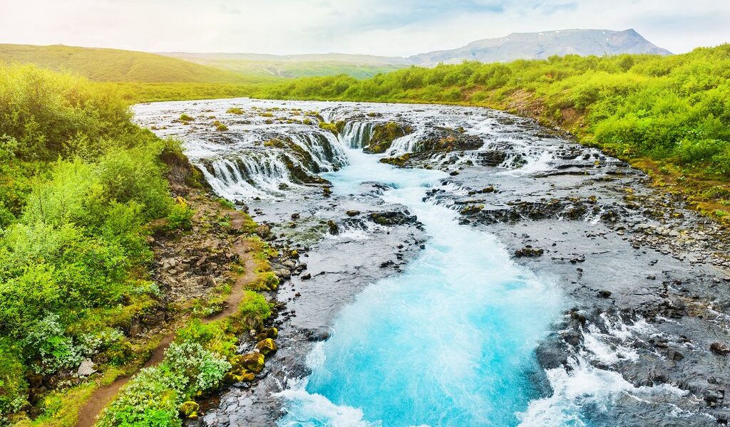 Bruarfoss Waterfall With Blue Water In Iceland. Beautiful Summer