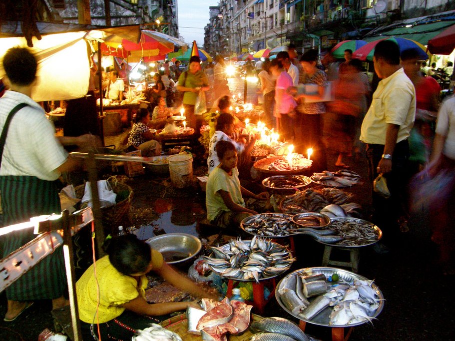 A lively outdoor market in Yangon