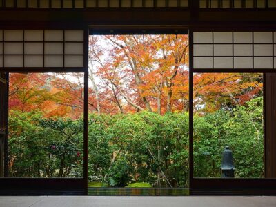 Wood frame doorway and tatami mats in traditional Japanese tea room in autumn