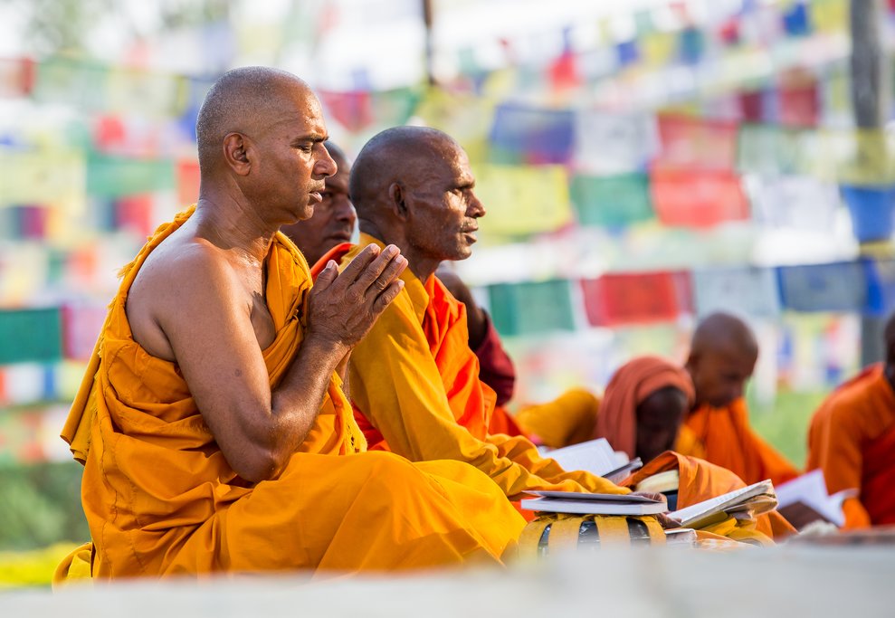Monks from southeast Asia in prayer at Buddha's birthplace