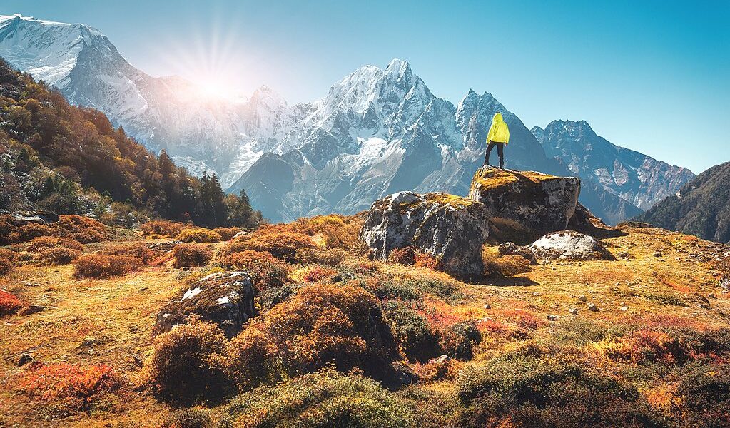 Standing Man On The Stone And Looking On Amazing Himalayan Mount