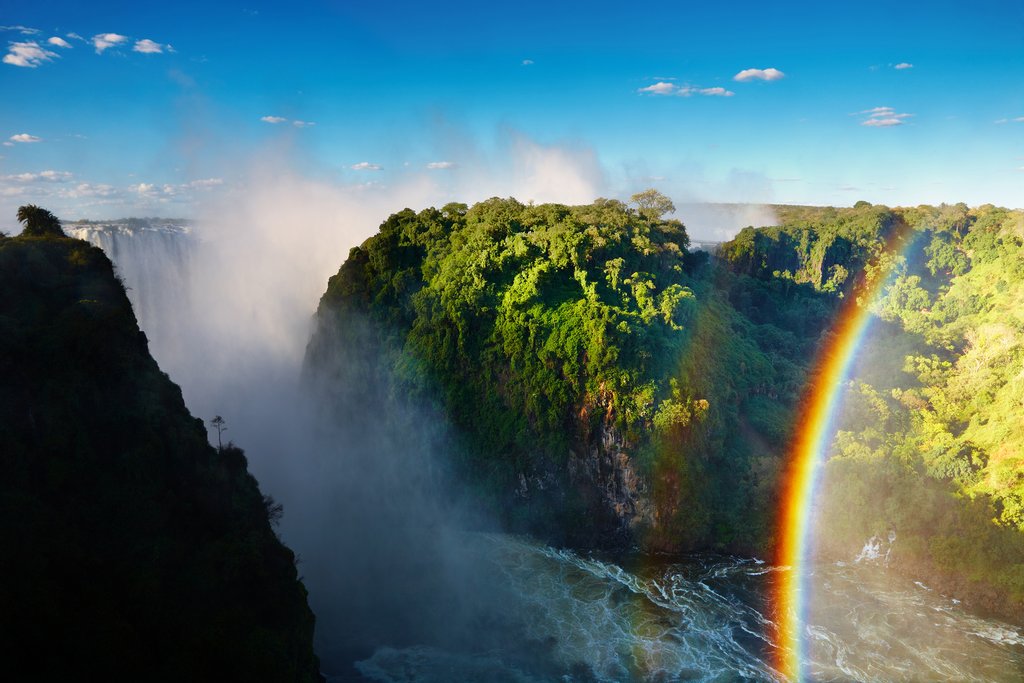 Rainbow created by mist at Victoria Falls