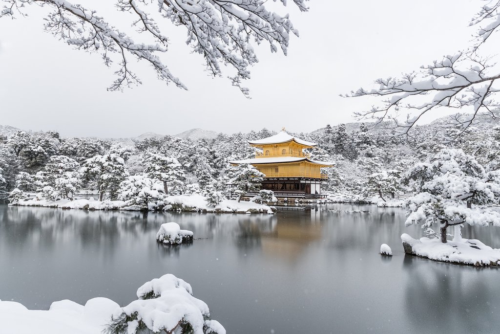 Snowfall over Kyoto's Golden Temple.