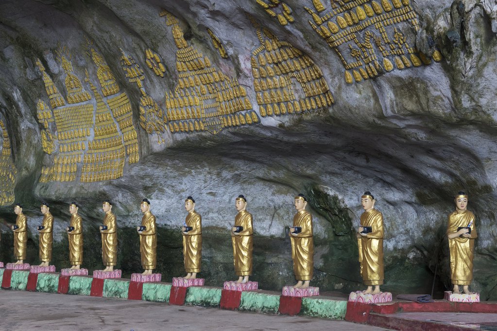 Statues and ornate walls inside Sadan Cave