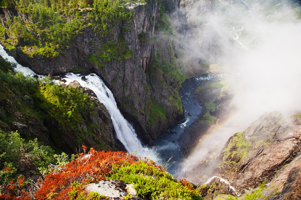 Sail along the sheer cliffs and icy waterfalls of Osterfjorden