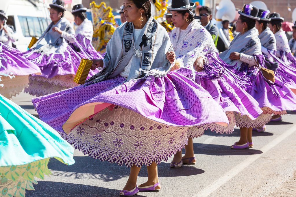 Colorfully dressed dancers at a street festival